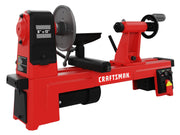 A red Craftsman wood lathe machine with black and gray accents. The lathe has an 8-inch by 13-inch capacity, a tool rest, and an on/off switch. The brand name 'CRAFTSMAN' is clearly visible on the side.