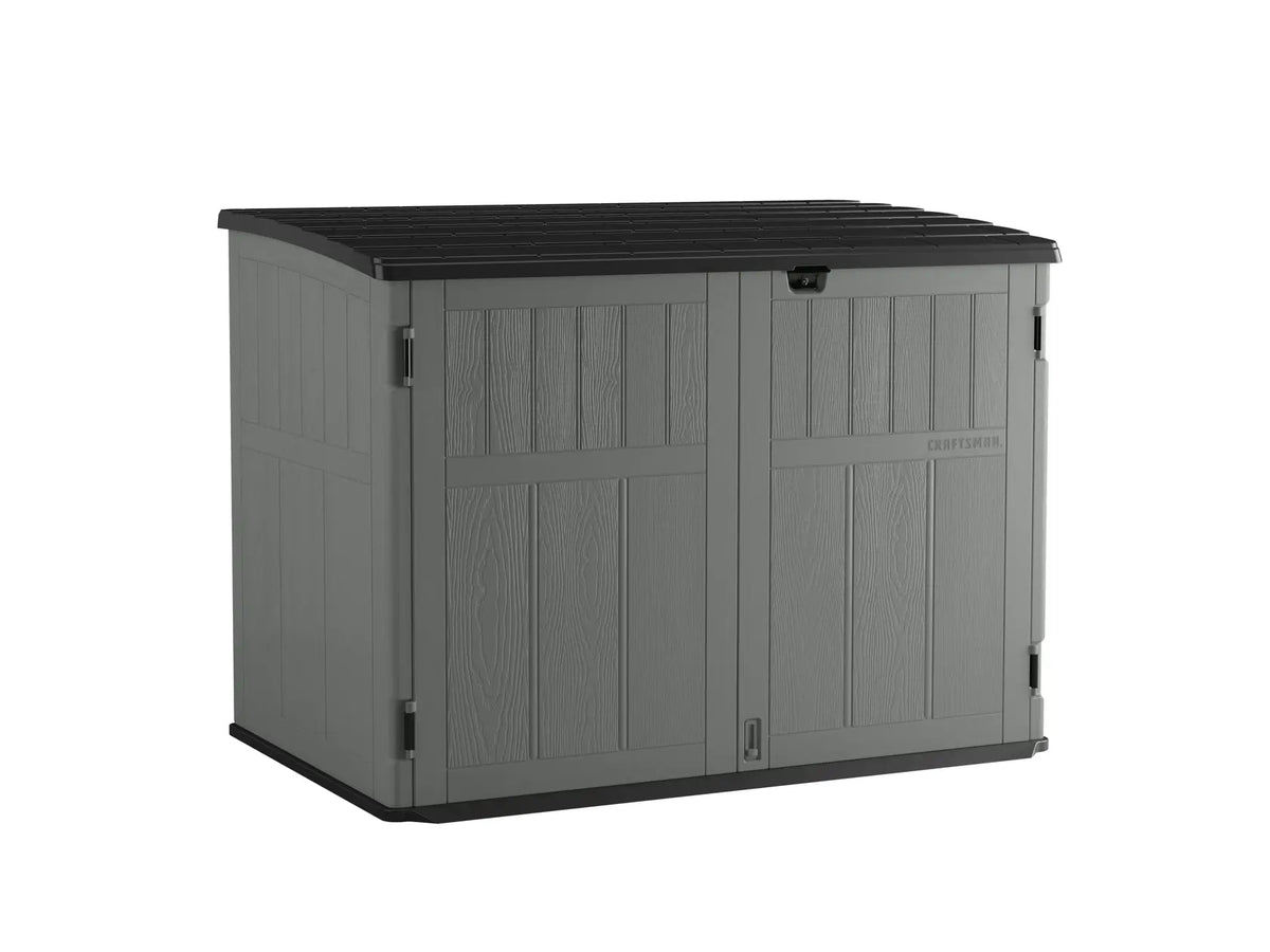 Photo of Craftsman outdoor storage shed CMXRCSCBMSC4752Z, gray with black lid, front angle on white background.